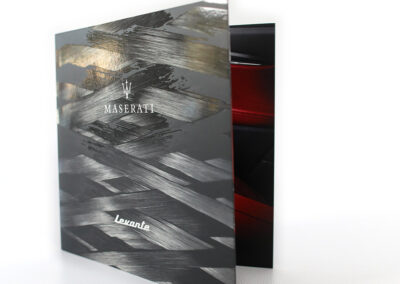 A photo of Maserati's Levante brochure, produced by Qualprint with raised spot UV and Silver embossed accents