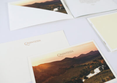 A photo of Quintessa's tasting guide, produced by Qualprint with gold foil accents and embossing