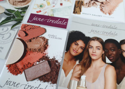 A photo of printed retail marketing collateral for Jane Iredale, produced by Qualprint.
