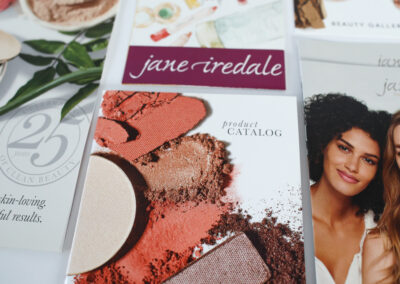 A photo of retail marketing collateral for Jane Iredale, produced by Qualprint.