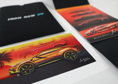 A photo of limited edition Lamborghini concept drawings, produced by Qualprint for direct mail fulfillment.